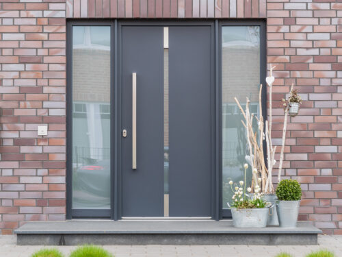 Contemporary composite doors installed in a modern home by construction & building company River.ODP in Surrey, UK
