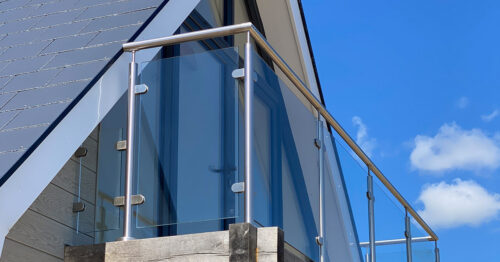 The round steel balustrade looks great from all angles on the balcony of a sea view house at Normans Bay, Eastbourne.