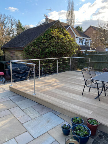 Modern stainless steel balustrade with a wired system installed on composite decking in Newhaven by Installation company River.ODP.