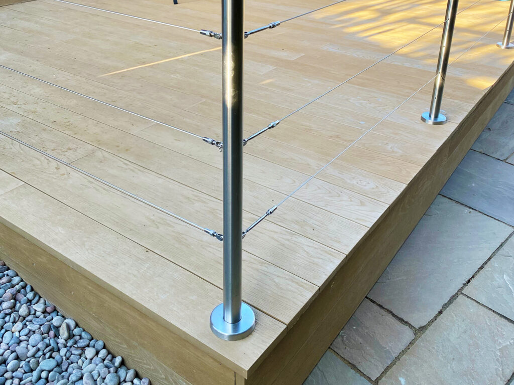 Composite decking with wire stainless steel balustrade installed in Arundel by Building company River.ODP