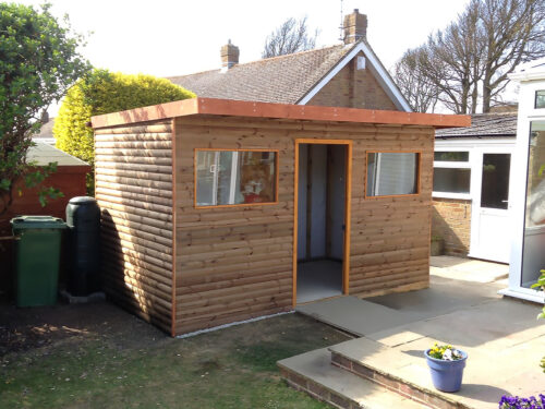 Insulated garden study room with wooden cladding built in Mayfield by River.ODP building company.