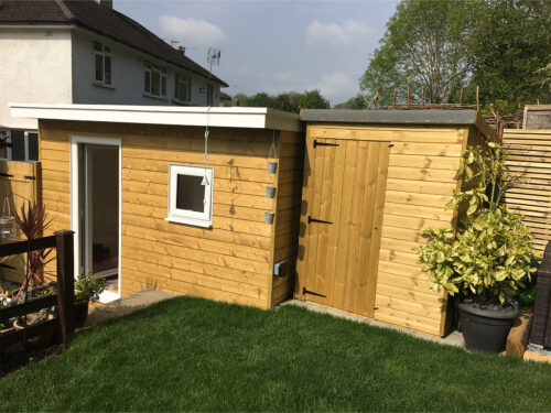 Insulated garden study room with wooden shed at the side built in Tadworth by River.ODP building company.