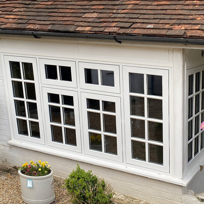 New white flush casement UPVC bay window with astragal bars mounted in house in Hailsham by builders from River.ODP.