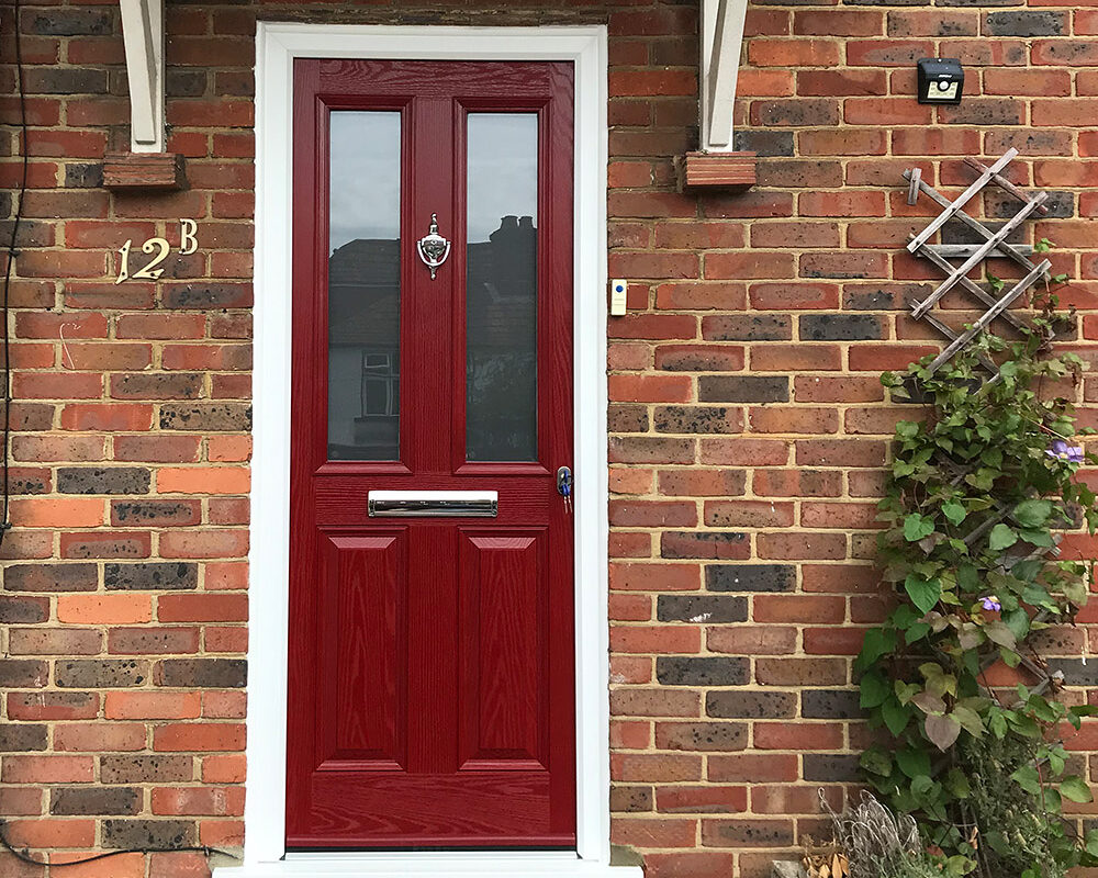 New Composite classic style front door in modern red colour mounted in Hailsham by installation company River ODP