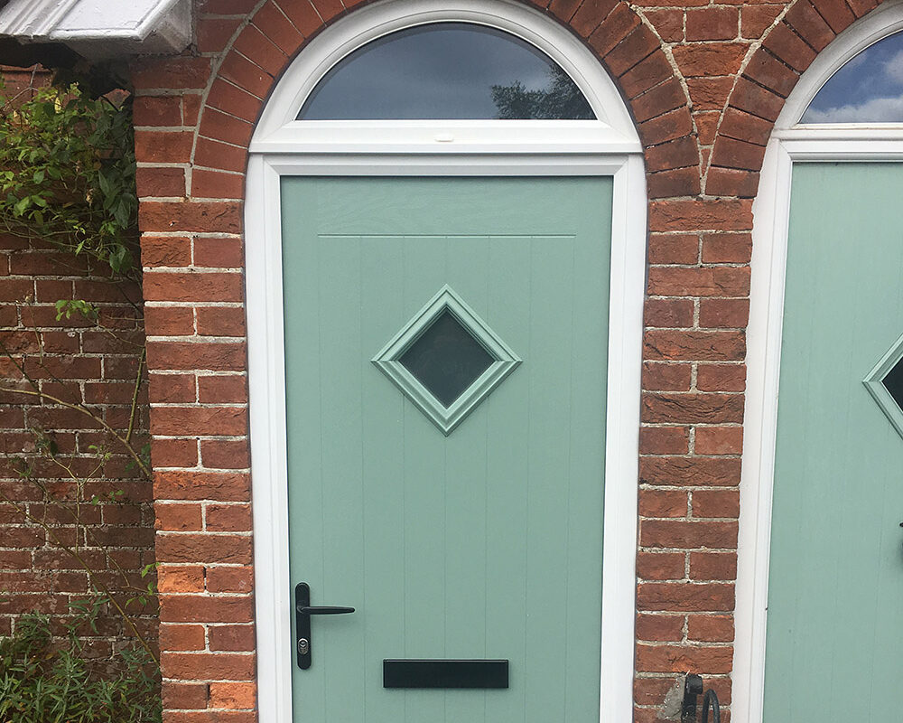 New door with arched window above.