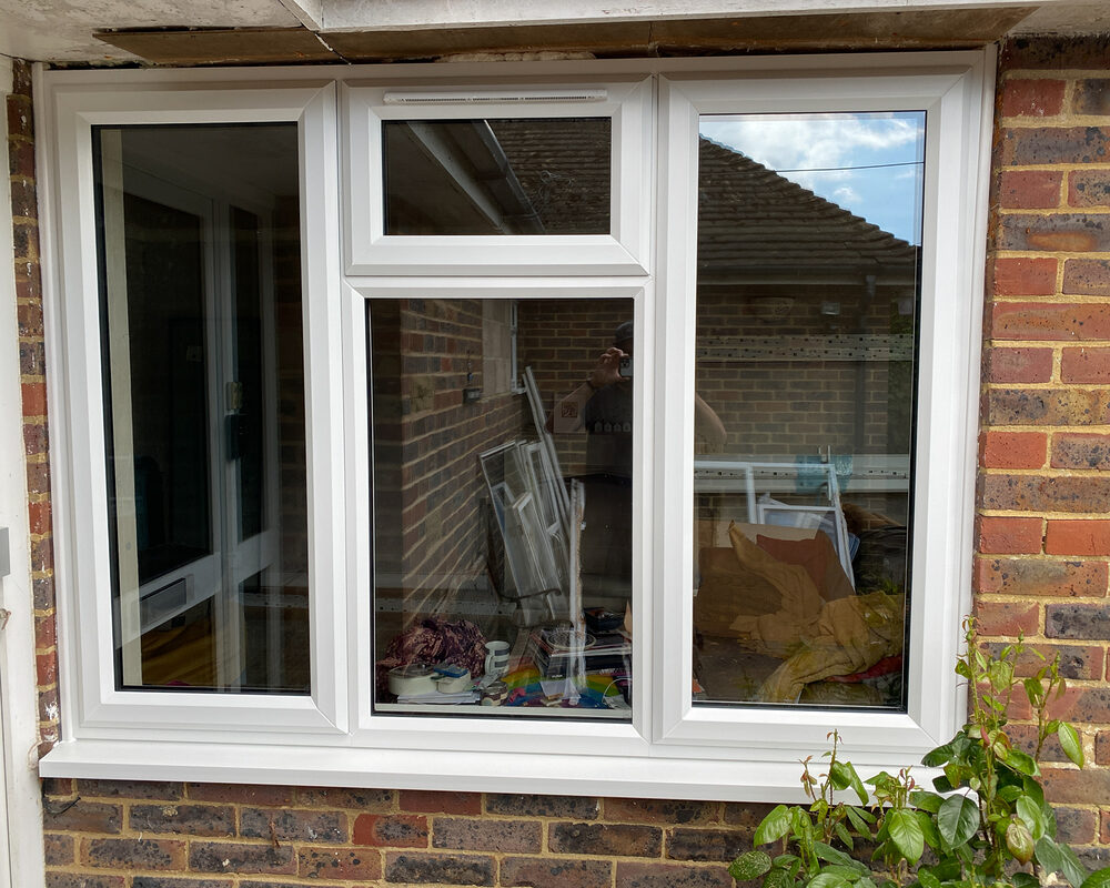 White UPVC triple Casement window with top leaf at the middle installed by River.ODP in Godalming in Surrey