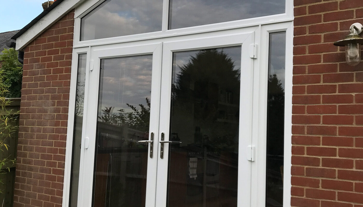 Bespoke white UPVC Casement windows with French doors installed in house extension by River ODP