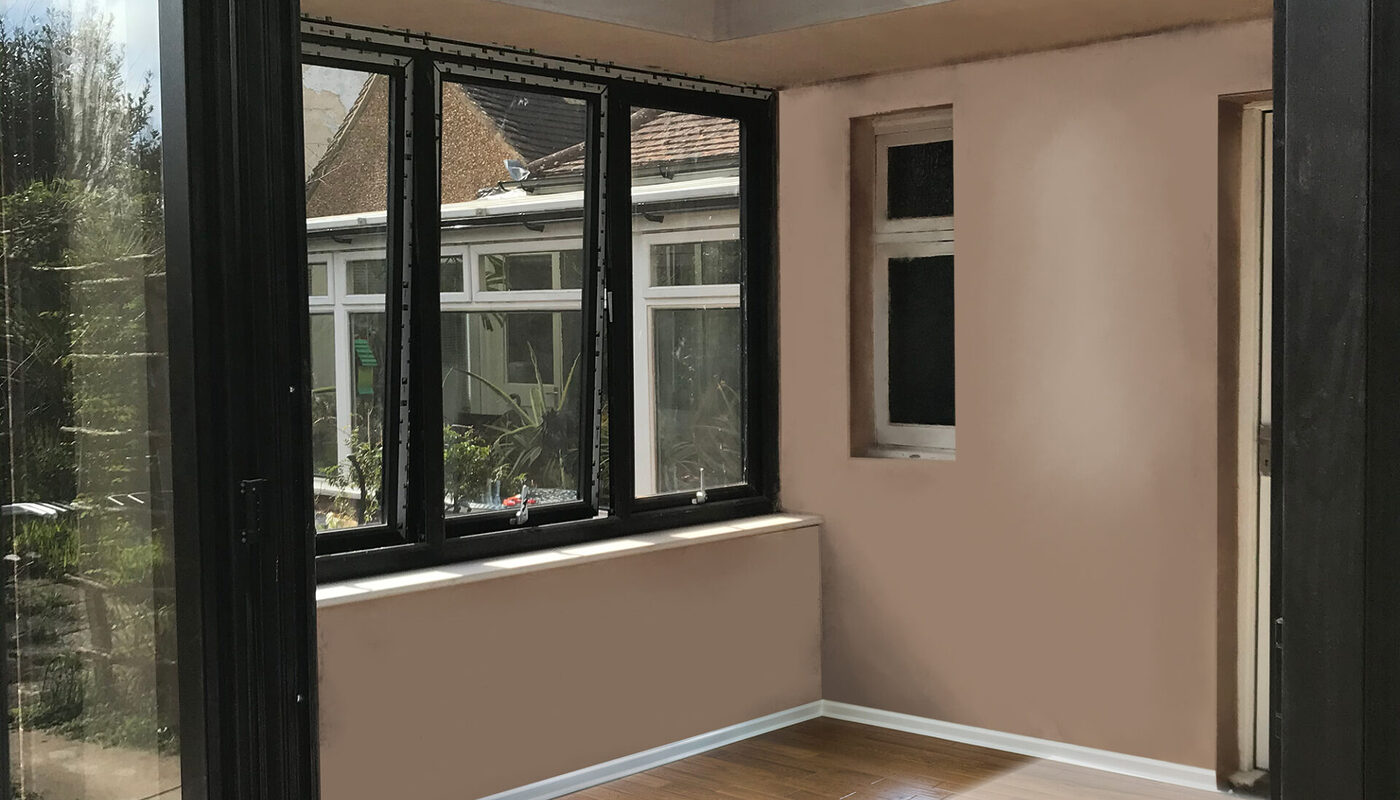 View to inside an orangery extension in Eastbourne East Sussex with lantern roof window and French doors.