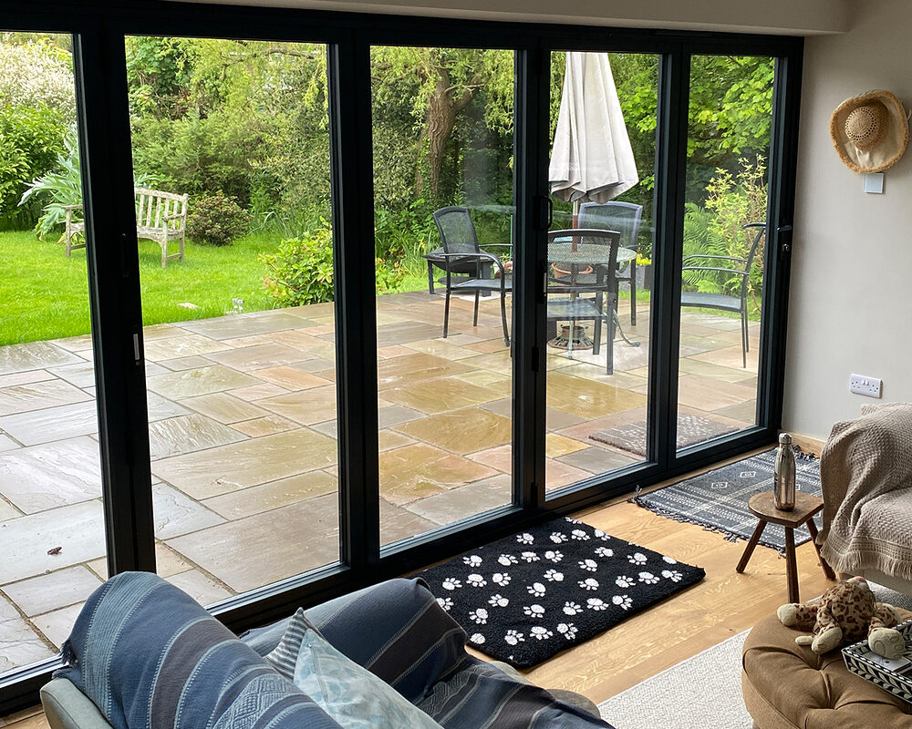 View from inside on Bi-folding aluminium patio doors installed in house extension in Magham Down by River ODP