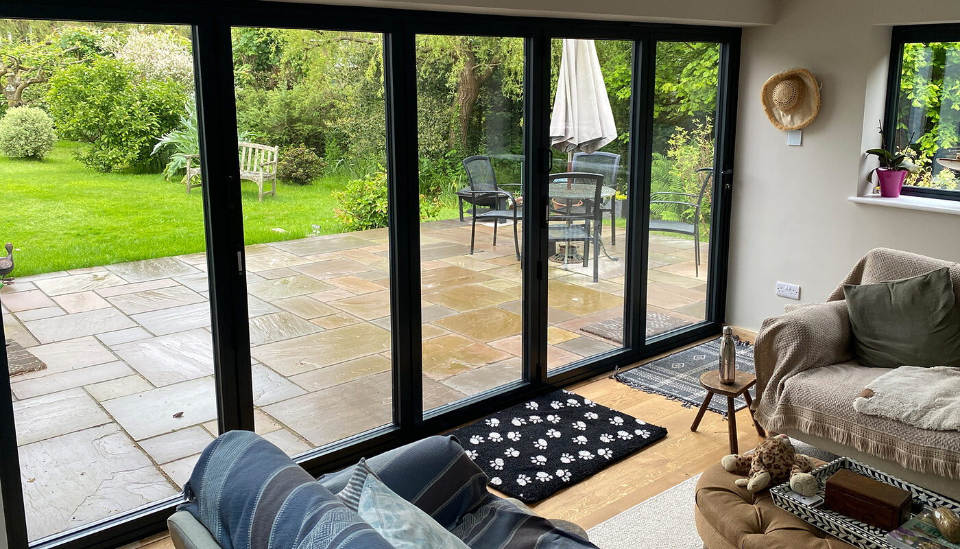 View from inside on Bi-folding aluminium patio doors installed in house extension in Magham Down by River ODP