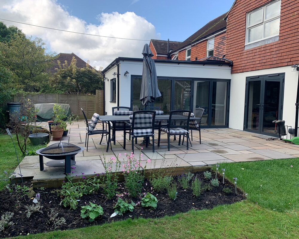 New modern extension with bi-folding graphite aluminium doors. Further view from the garden. Built by contractor River ODP