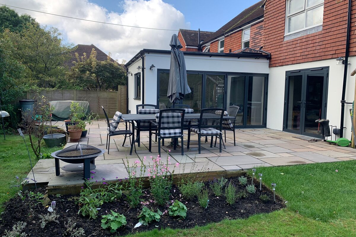 New modern extension with bi-folding graphite aluminium doors. Further view from the garden. Built by contractor River ODP