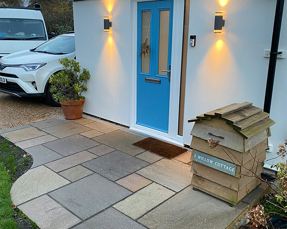 Indian Stone patio installed in front of a house in Magham Down by River ODP – a construction company.