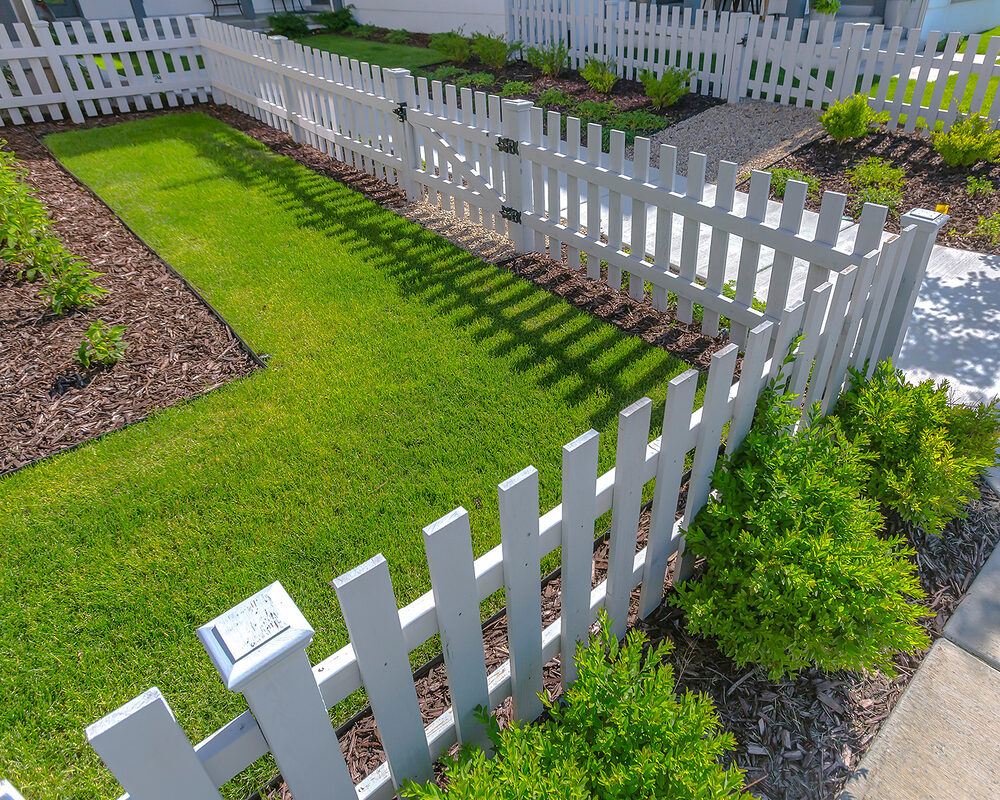 White timber short fence installed around front garden in East Sussex installed by River ODP