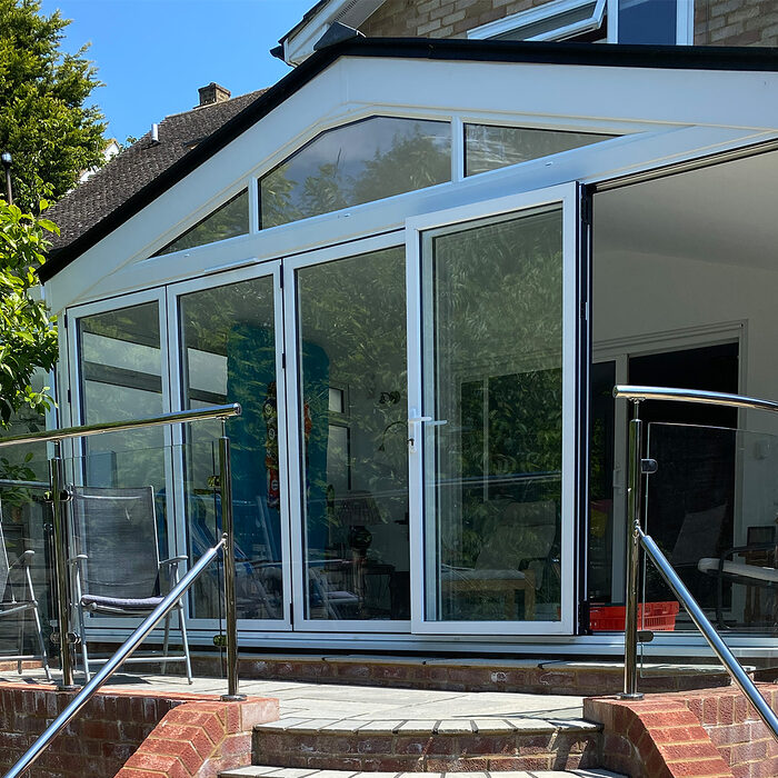 Edwardian style conservatory with wide bi-folding doors build by River.ODP construction company in Bexhill, East Sussex.