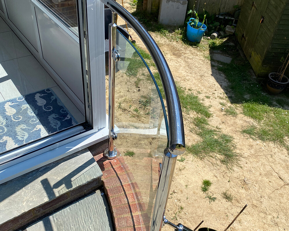 Handrail installed on stainless steel balustrade with glass panel in Lindfield by River.ODP, professional installers and builders.