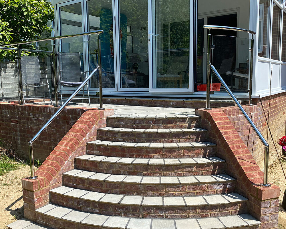 Edwardian style conservatory with wide bi-folding doors and glass balustrade build by River.ODP construction company in Bexhill, East Sussex.