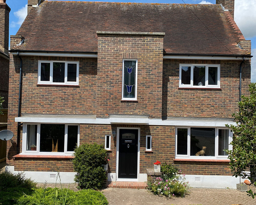 House with new uPVC white windows installed by building company River.ODP in Caterham in Surrey.
