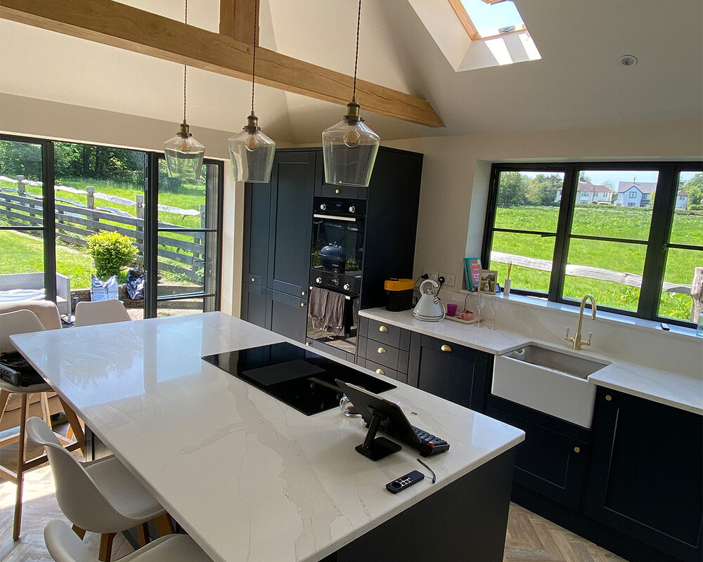 Marine blue kitchen installation with Calacatta quartz worktop fitted by kitchen installers in Sevenoaks - River.ODP, builders and installers.