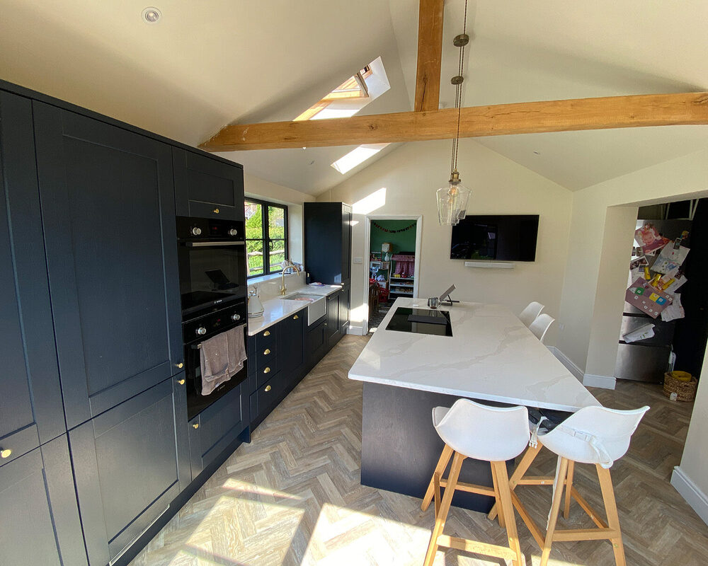 Marine blue kitchen installation with quartz worktop fitted by kitchen installers in Ramsgate - River.ODP, building company.