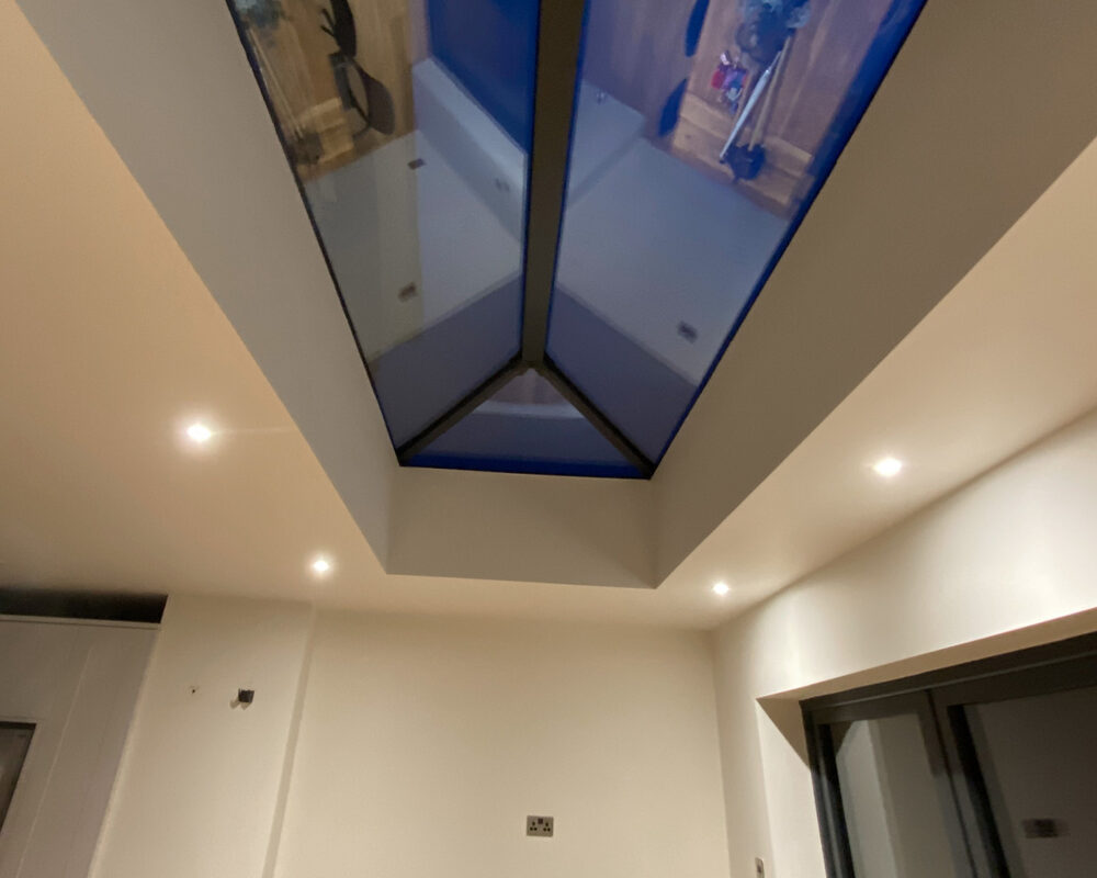Modern dining area with roof window in Gillingham by builders and installers River.ODP, kitchen design specialists.