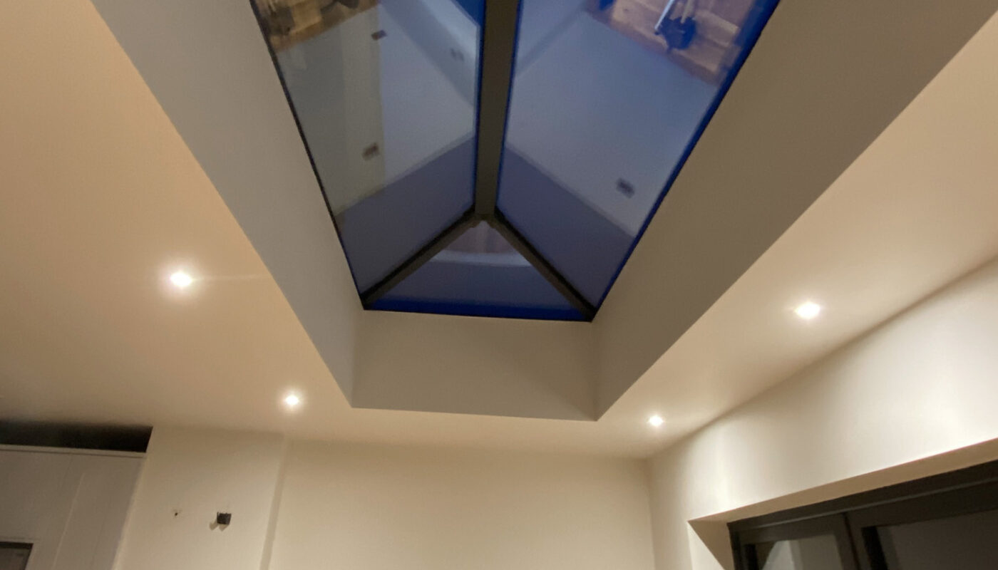 Modern dining area with roof window in Gillingham by builders and installers River.ODP, kitchen design specialists.