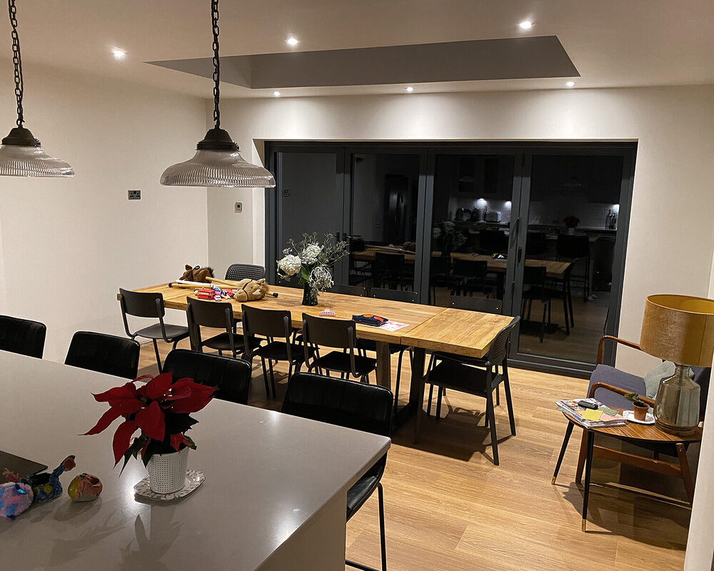 View from kitchen to dining area extension in Wadhurst made by building company River.ODP, kitchen installers and designers.