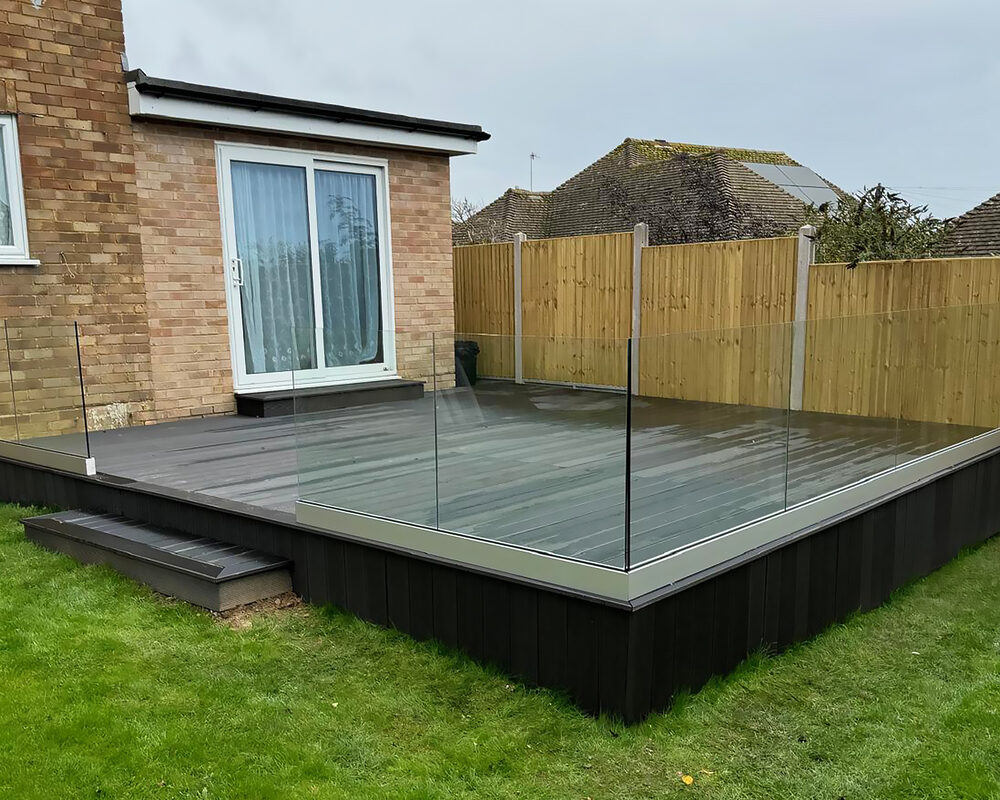 Composite decking, Frameless glass balustrade installation in Egham by builders from construction company River.ODP.