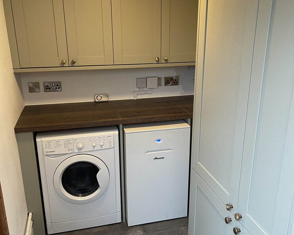 Small shaker utility in kitchen installed in Crawley by builders from River.ODP building company, kitchen design and installation specialist.