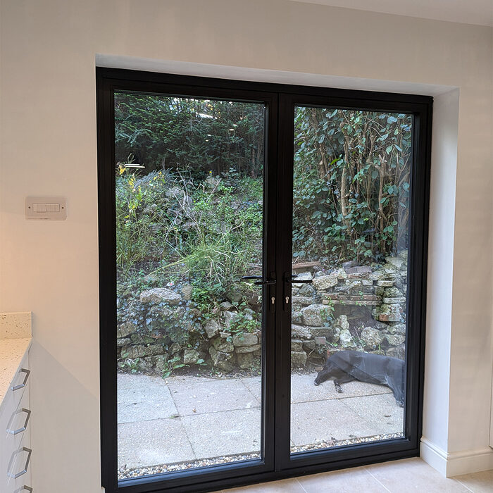 Minimalist white kitchen installed in Billingshurst by builders from building company River.ODP - expert kitchen installers.
