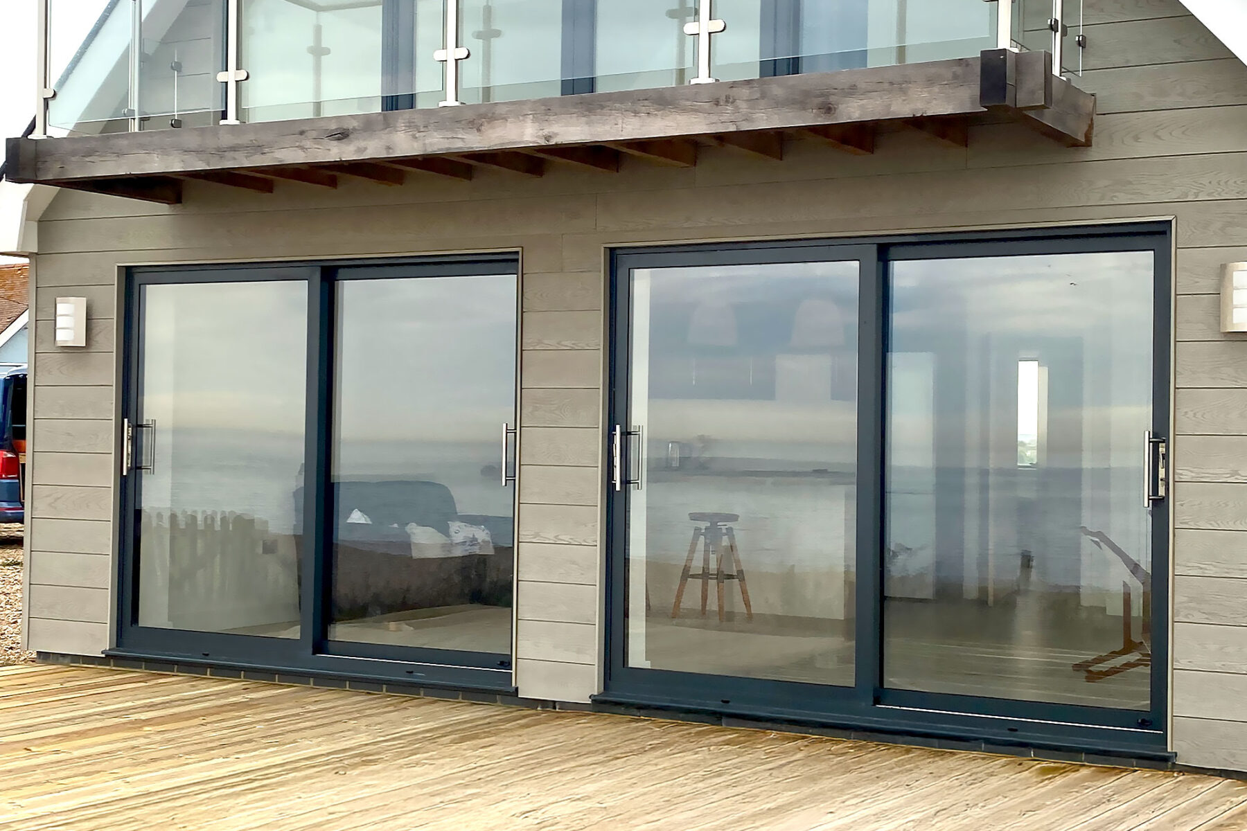 Two aluminium sliding patio doors in anthracite colour installed by River.ODP in Normans Bay, Eastbourne.