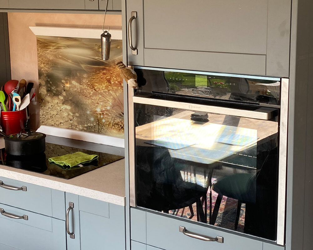 Shaker style slate grey kitchen tall cabinet with oven installed in Uckfield by installation company River.ODP kitchen builders and installers.