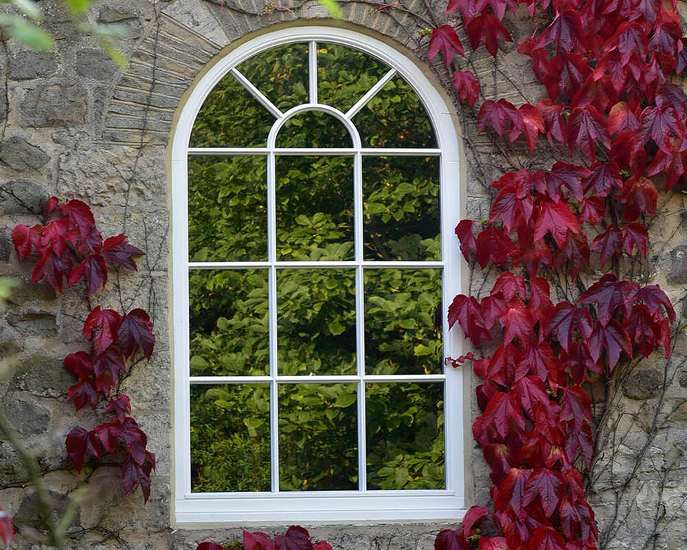 Rounded Fixed window with astragal bars installed in house in Kent.