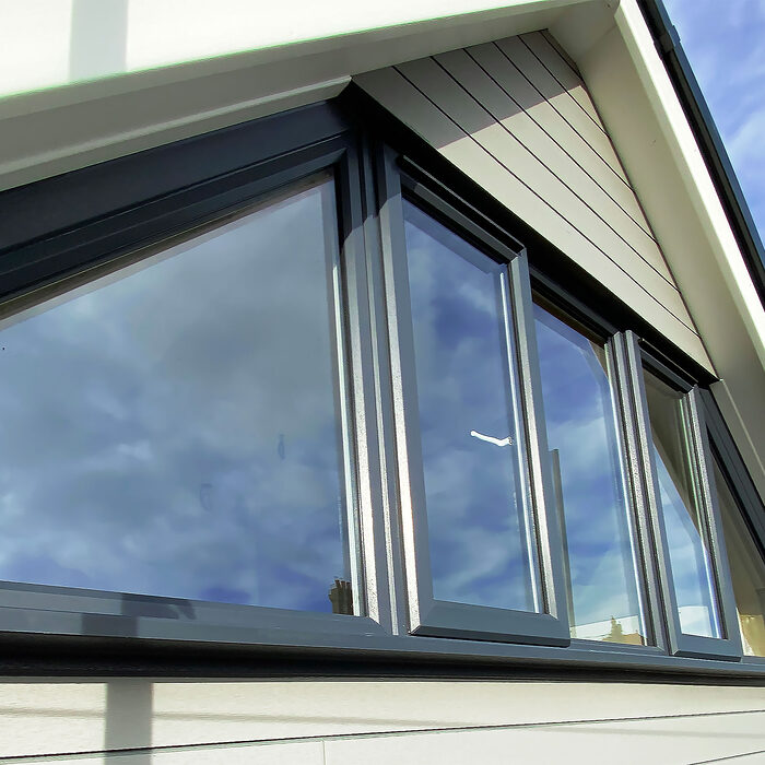 Zoom on modern Bespoke Casement windows in anthracite colour installed by River.ODP in Bexhill on Sea in East Sussex.