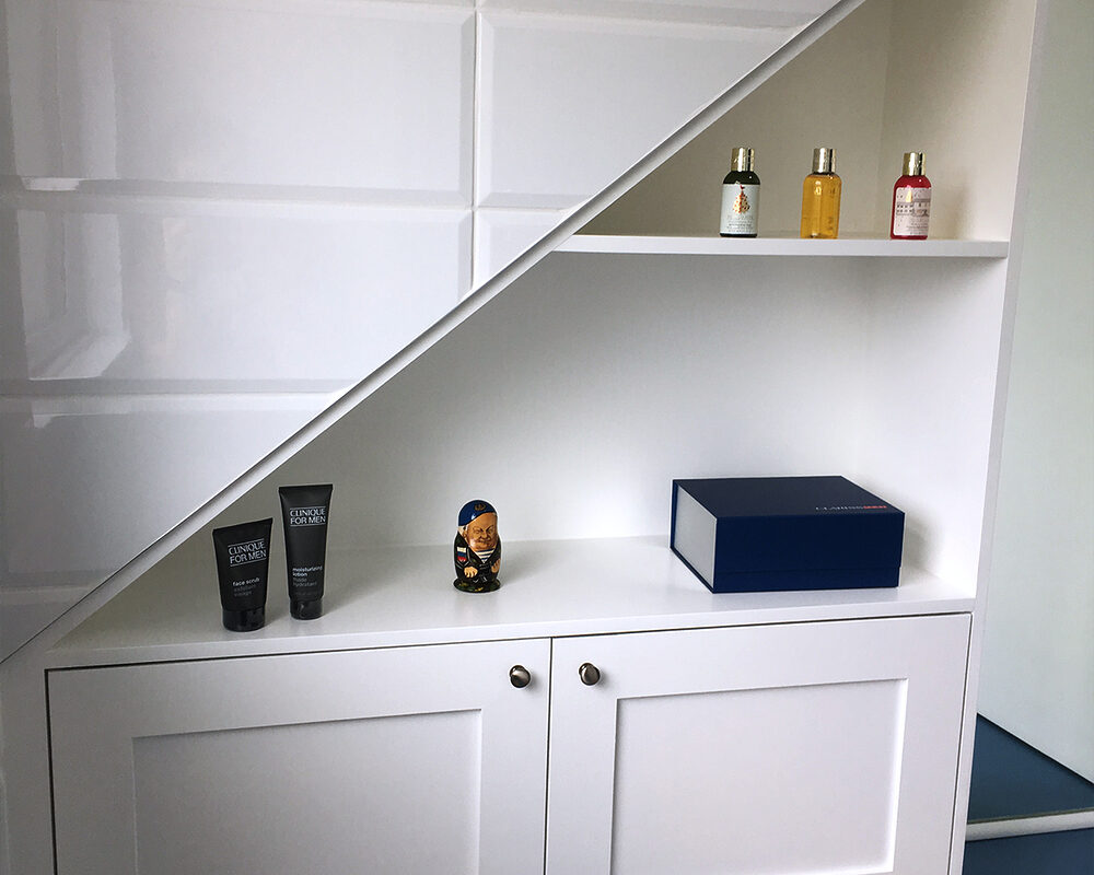 Compact loft bathroom with blue flooring and white fixtures in Seaford, installed by River.ODP