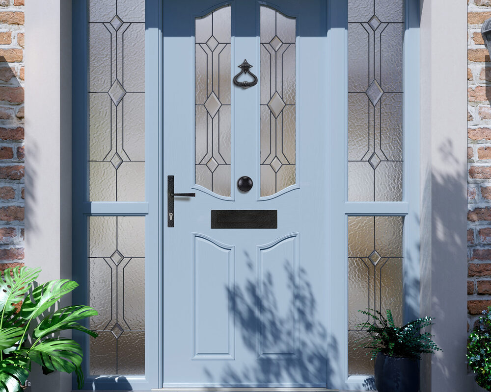 Classic style composite door with two tall side windows fitted by River ODP professionals to a brick house in West Sussex.