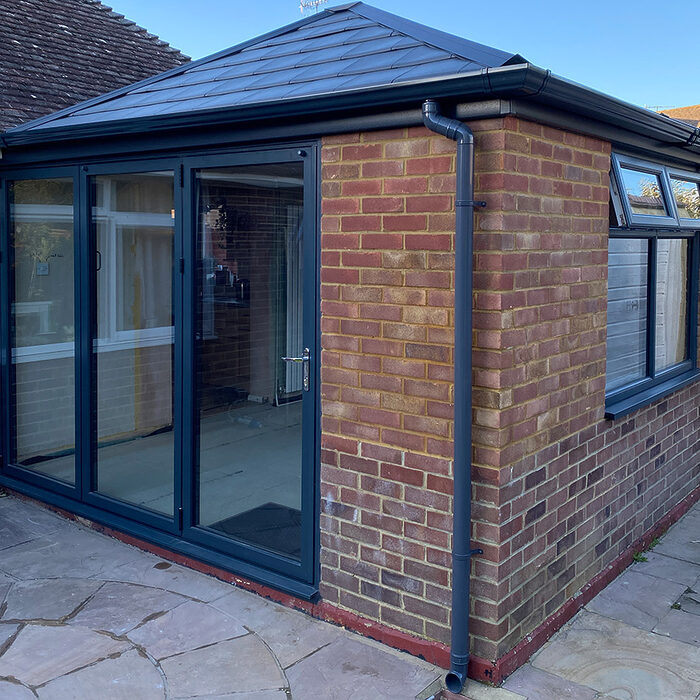 Old Conservatory was changed to modern orangery extension with anthracite windows and bi-folding patio doors. River.odp