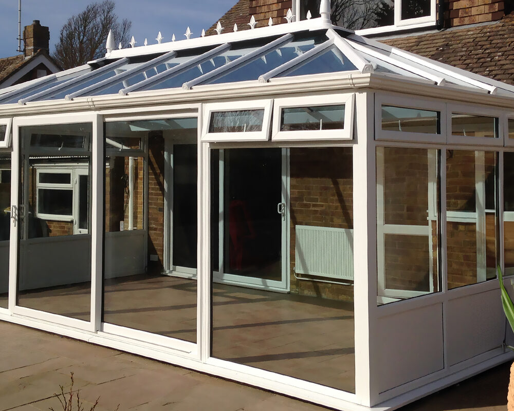 White uPVC Edwardian conservatory designed and constructed by the contractor and building company River.ODP in East Sussex