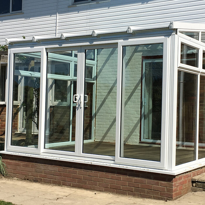 White uPVC Lean-to conservatory designed and constructed by the building company River.ODP in Seaford, East Sussex
