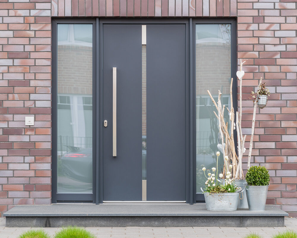 Contemporary composite doors installed in a modern home by construction & building company River.ODP in Surrey, UK